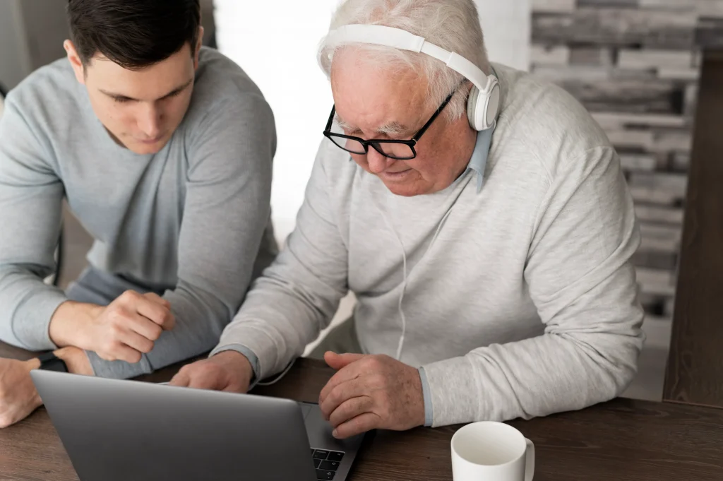 grand parent learning use digital divice 11zon
