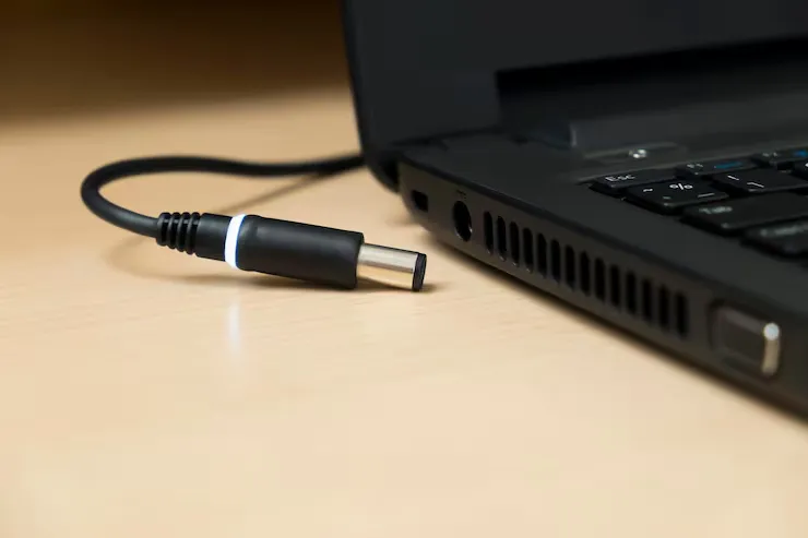 close up laptop with cable table 1048944 12010244 11zon
