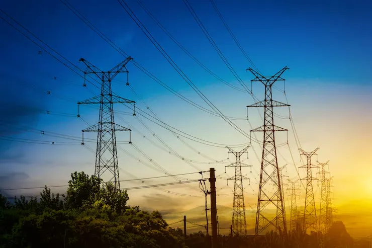 sun setting silhouette electricity pylons 1127 3239 11zon